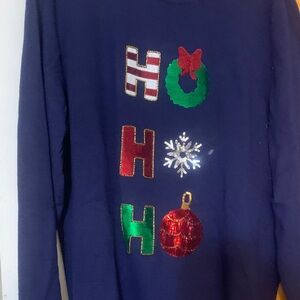 Festive Holiday Sweater with Colorful Accents. Spells ho ho ho